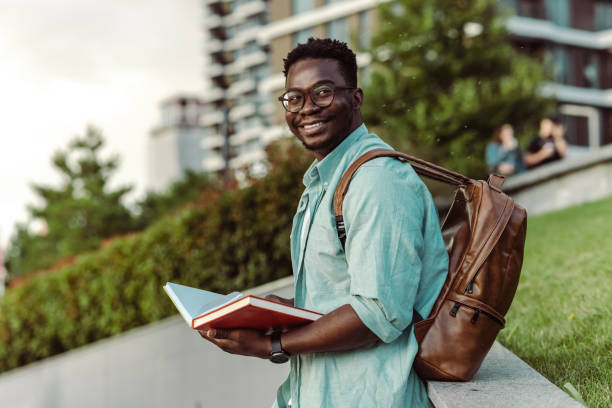 istock An African American student with backpack holding his notebooks 1408505265