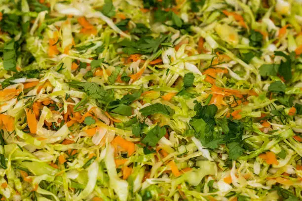 Photo of Close up of coleslaw and greens for sale at the international street food festival