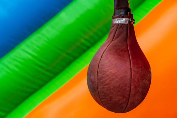 Punching bag for fun on a blurred colored background and copy space for text
