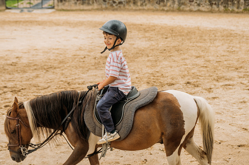 Boy riding a horse in Mexico City