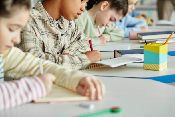 istock Kids Taking Exam Closeup 1408507425