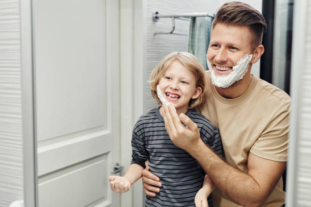 istock Happy Father and Son Shaving 1408510211