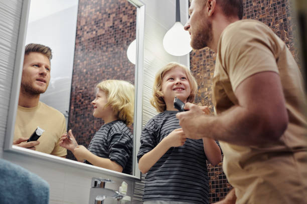 istock Happy Little Boy with Father in Bathroom 1408510233