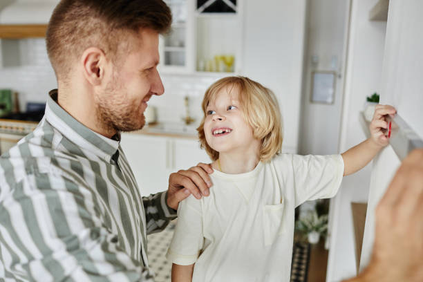 istock Little Boy Helping Father with Home Improvement 1408510238