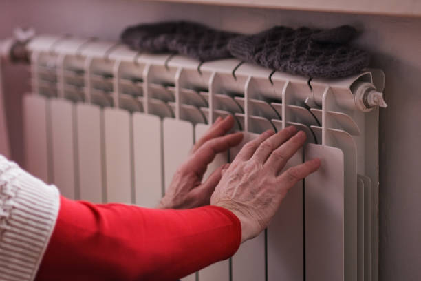 istock Man feeling cold at home with home heating trouble 1408510770