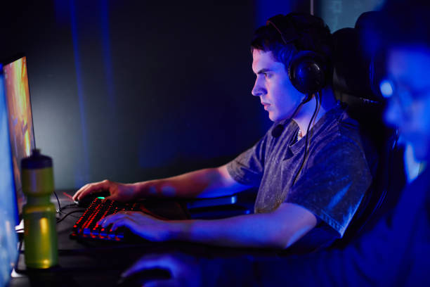istock Man Playing Video Games in Neon Light 1408511410