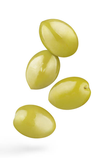 istock Flying delicious olives on white 1408512535