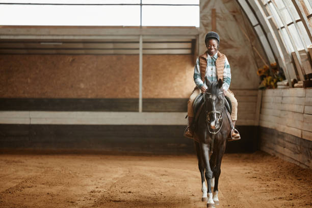 istock Smiling Woman Riding Horse 1408512776