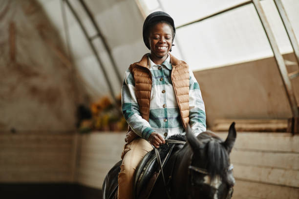 istock Woman Enjoying Horse Riding 1408512787