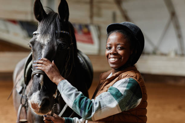 istock Smiling Black Woman with Horse 1408512796