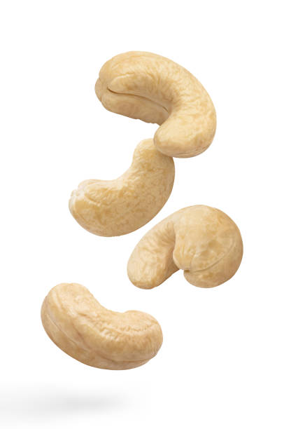 istock Flying delicious cashew nuts on white 1408512827
