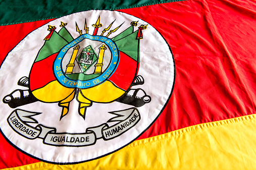 Flag / bandera of Mexico against a bright blue sky