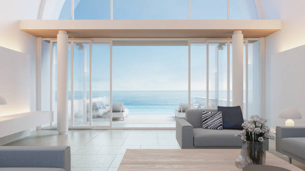villa di lusso sulla spiaggia vista mare interni design moderno - rendering 3d - santorini greece villa beach foto e immagini stock