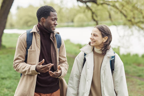istock Happy young couple walking outdoors 1408514377