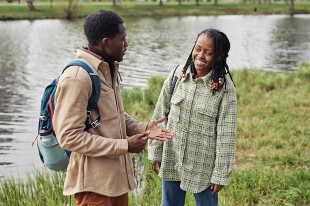 istock African couple walking in the park 1408514429