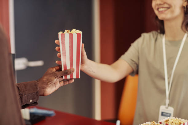 istock Seller selling popcorn to customer 1408514453