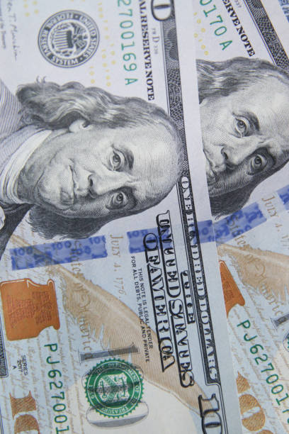 istock One hundred dollar bills, close-up. Financial background. 1408516204