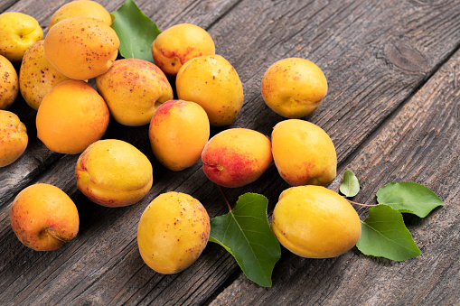 Apricots on a  wooden background