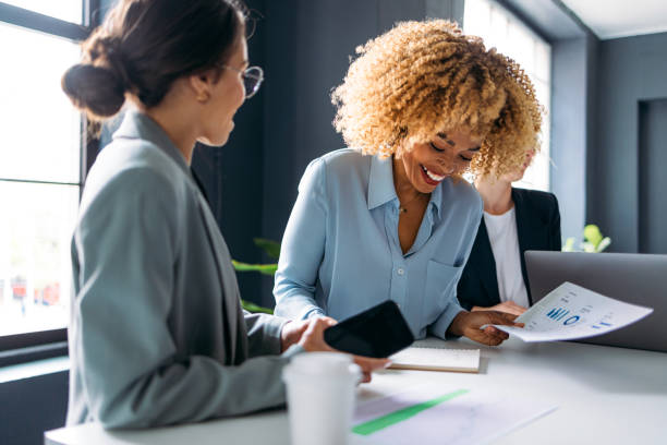istock Three Business Woman Working Together On A New Project 1408517145