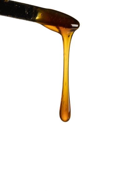 Dripping honey isolated on white background