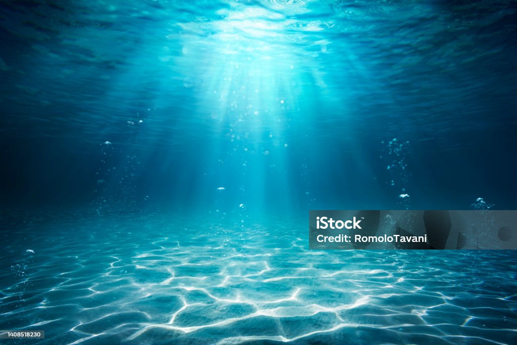 Underwater Sea - Deep Water Abyss With Blue Sun light Under water Ocean - Seabed With Sunbeam Sea Stock Photo