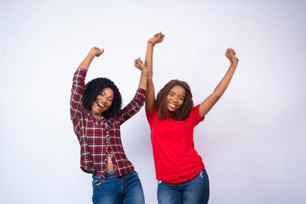 istock two beautiful young black ladies feeling excited and celebrating 1408520172