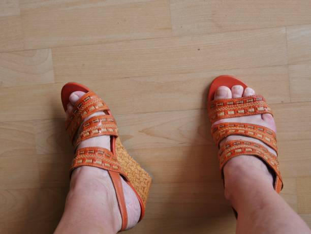 istock Orange sandals with wedge heel 1408522781