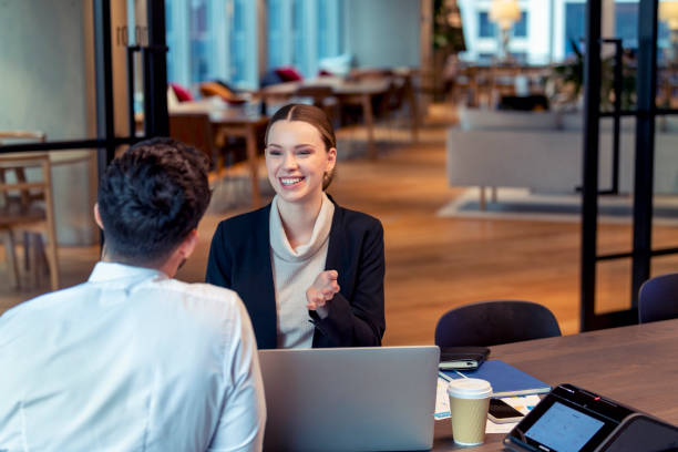 istock Two business people meeting in an office.. 1408526154