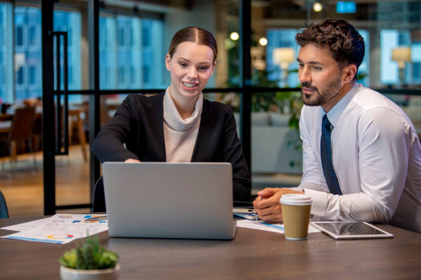 istock Two business people meeting in an office.. 1408526156