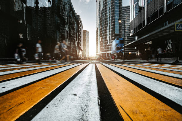 istock People walking across a crosswalk in modern downtown 1408526325
