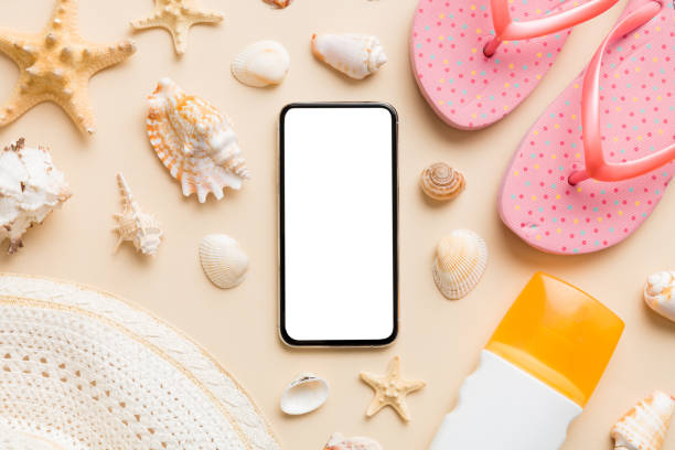 istock Flat lay composition with Phone and beach accessories on colored background. Smartphone with blank screen mock up with copy space 1408528484