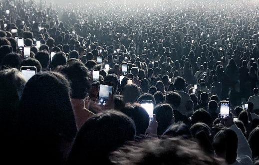 Crowd using cellphones at a concert
