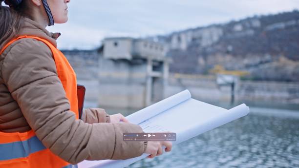 istock Female engineer working in hydroelectric dam. Ecology orientated. Renewable energy systems. 1408536661