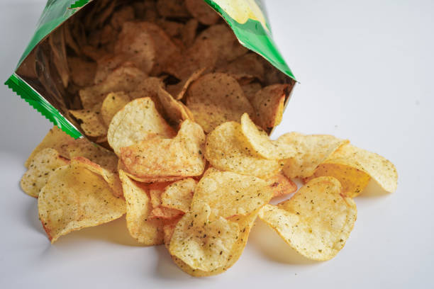 istock Potato chips in open bag, delicious BBQ seasoning spicy for crips, thin slice deep fried snack fast food in open bag. 1408538663