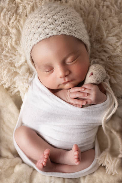 istock Newborn baby boy sleeping in a box 1408543467