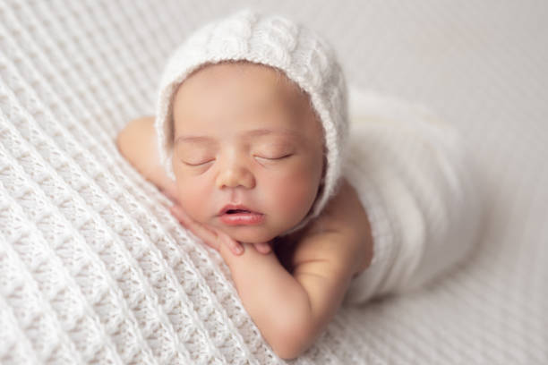 istock Newborn baby girl sleeping 1408543523
