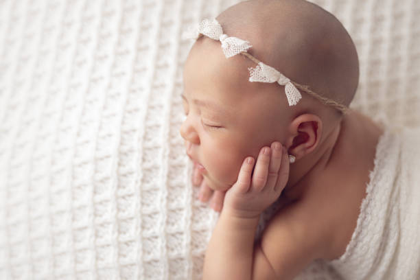 Cute 14 days-old baby boy sleeping confortable - Light blue colors - Buenos Aires - Argentina