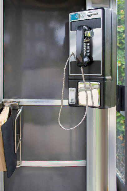istock classic full-length outdoor pay phone booth with phone book 1408544883