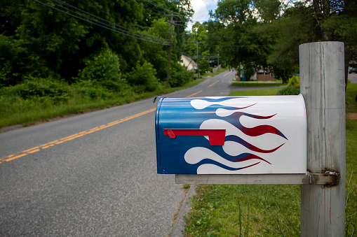 The owner of this mailbox loves speed - automobiles, plans, boats