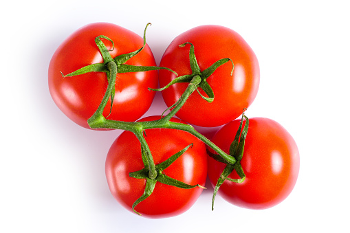 Top view on bunch of ripe red tomatoes isolated on white background