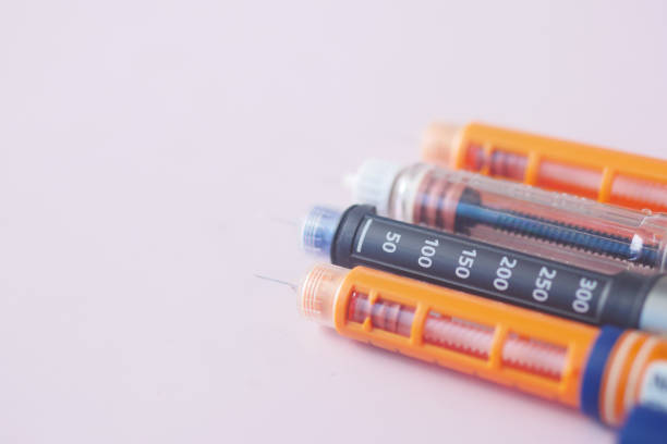 istock many Insulin pens on light pink background 1408550604