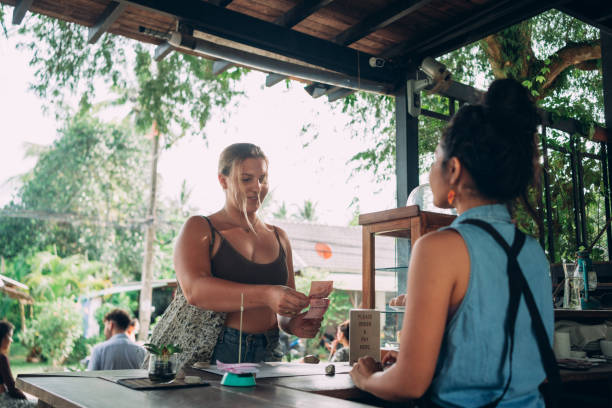 istock Customer paying for a coffee with a cash 1408555920