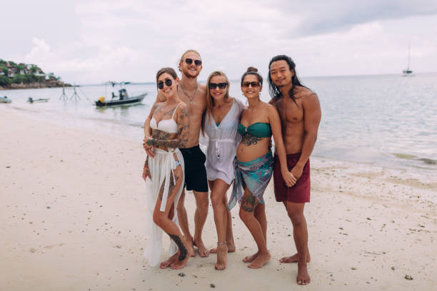 istock Tourists on the beach 1408557186
