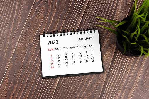 2023 January calendar on top of table