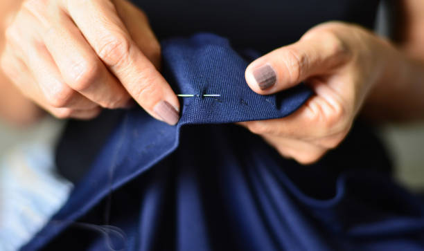 istock Women's hands are doing sewing activities with traditional craftsmanship. 1408560353