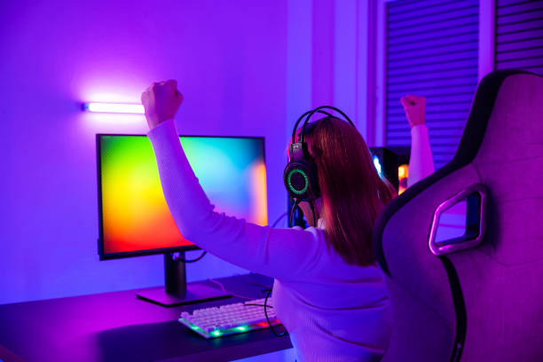 istock Asian gamer playing online video game excited on desktop computer 1408562139
