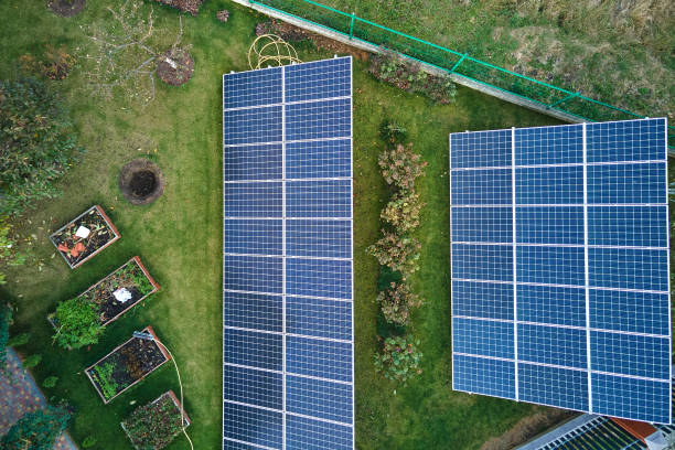 istock Solar photovoltaic panels mounted on stand-alone frame on backyard ground for generating of clean ecological electric energy. Concept of autonomous house 1408564689