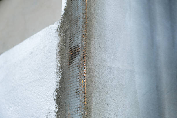 istock Installation of styrofoam insulation sheets on house facade wall for thermal protection. 1408564728