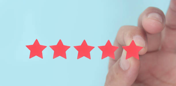 istock Rise on increasing five stars in human hand, Increase rating 1408566068