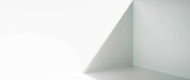 istock The direction of light and shadow of an empty white room space. 1408570215